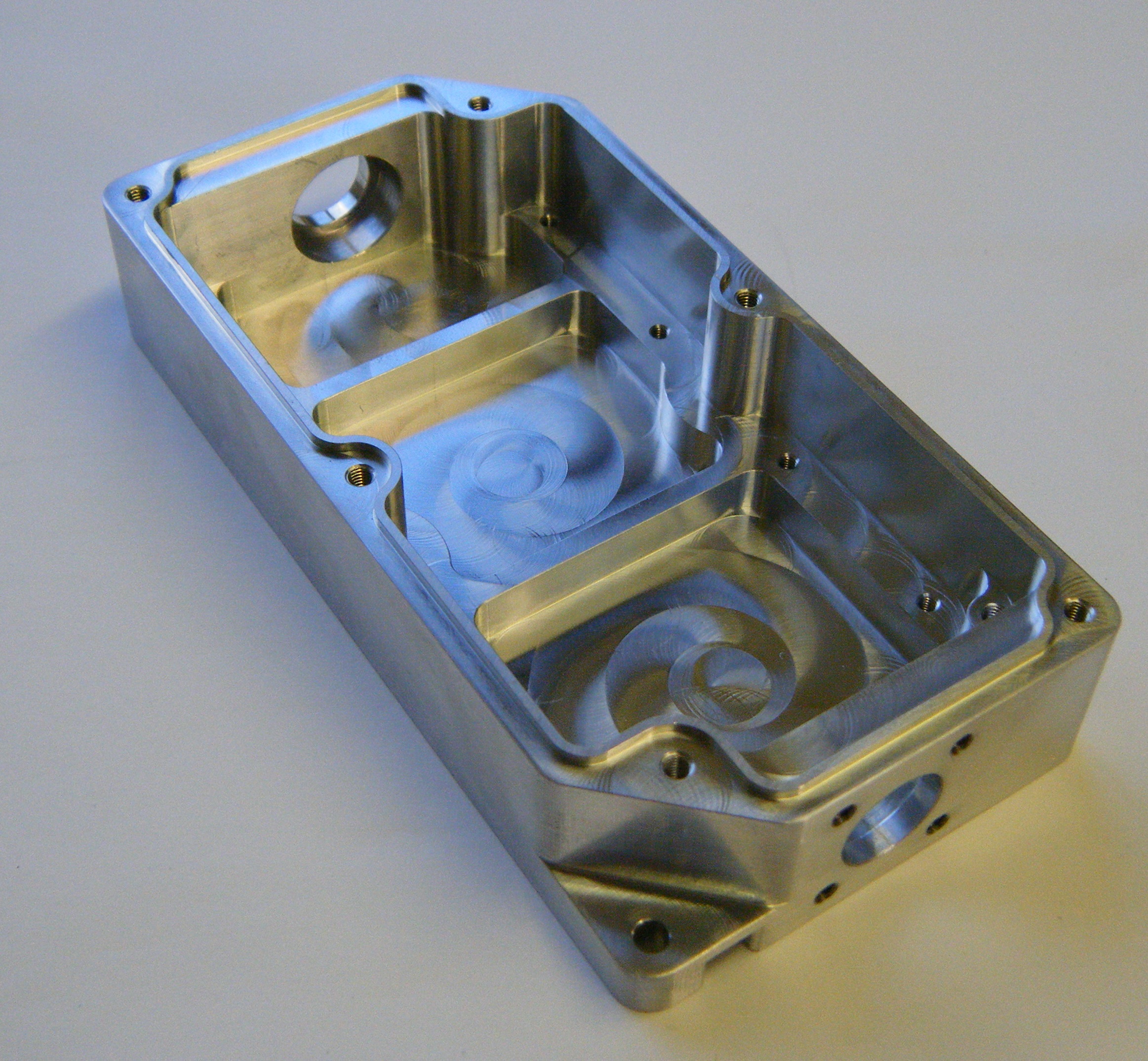 Complex milled housing with threaded features